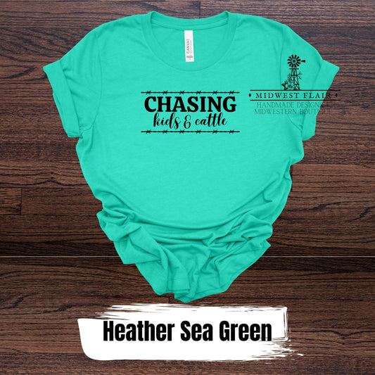 Chasing Kids and Cattle- T Shirt [Choose Your Shirt Color]