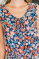 Meadow Mischief Sleeveless Romper in Navy/Orange/Teal